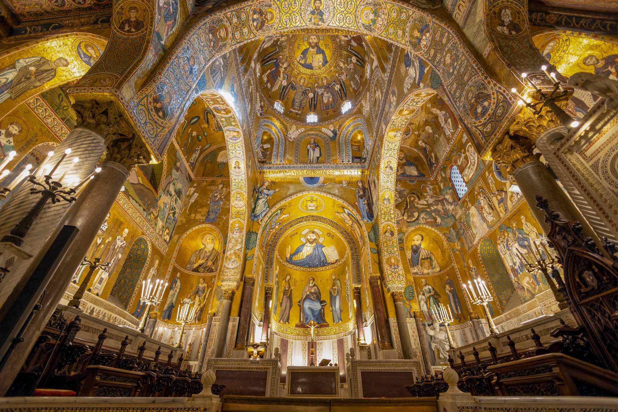 The gold Byzantine mosaics and Arab-Norman arches inside Palermo's Cappella Palatina.