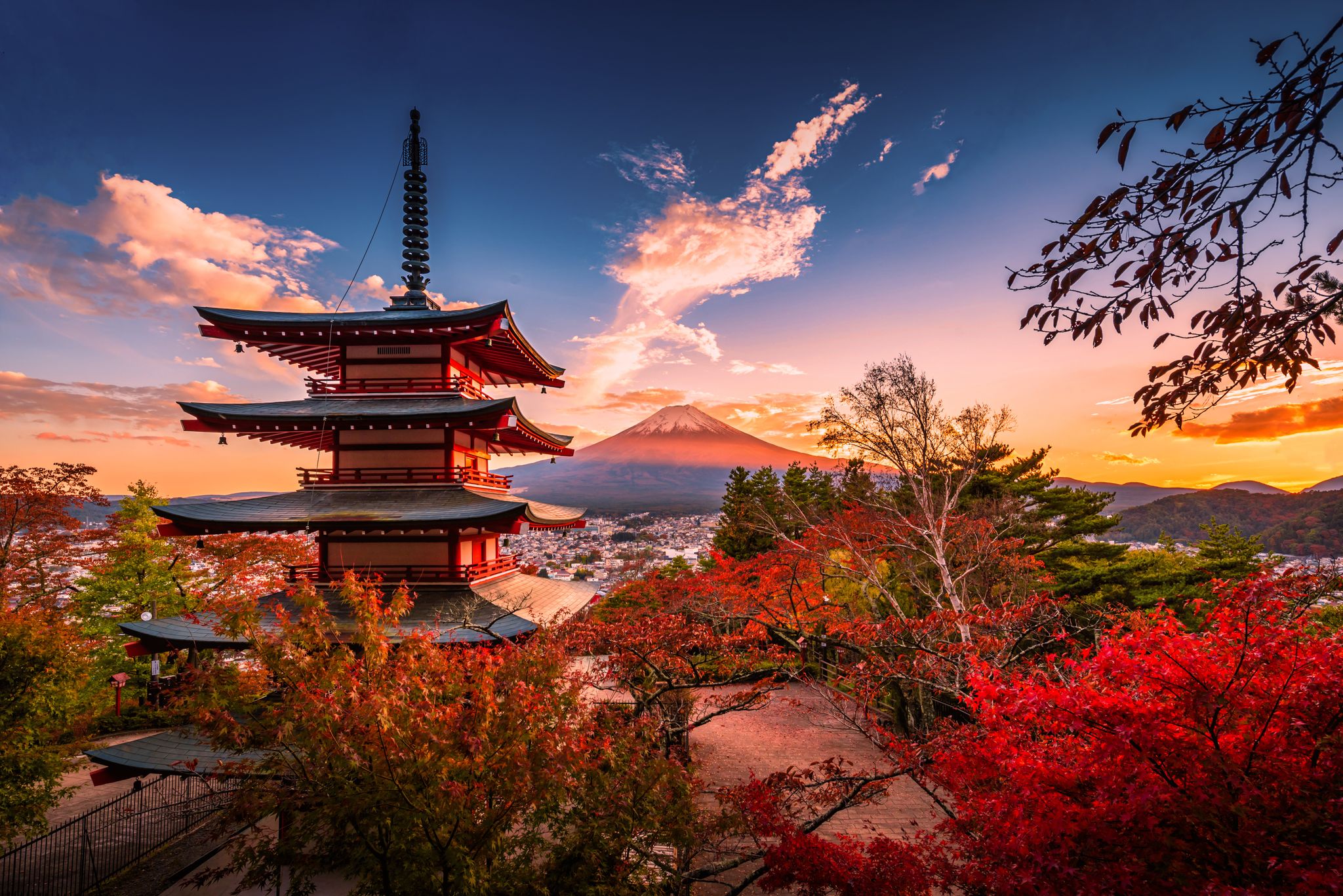 Mt. Fuji with Chureito Pagoda and red leaves in the autumn at sunset at Fujiyoshida, Japan.