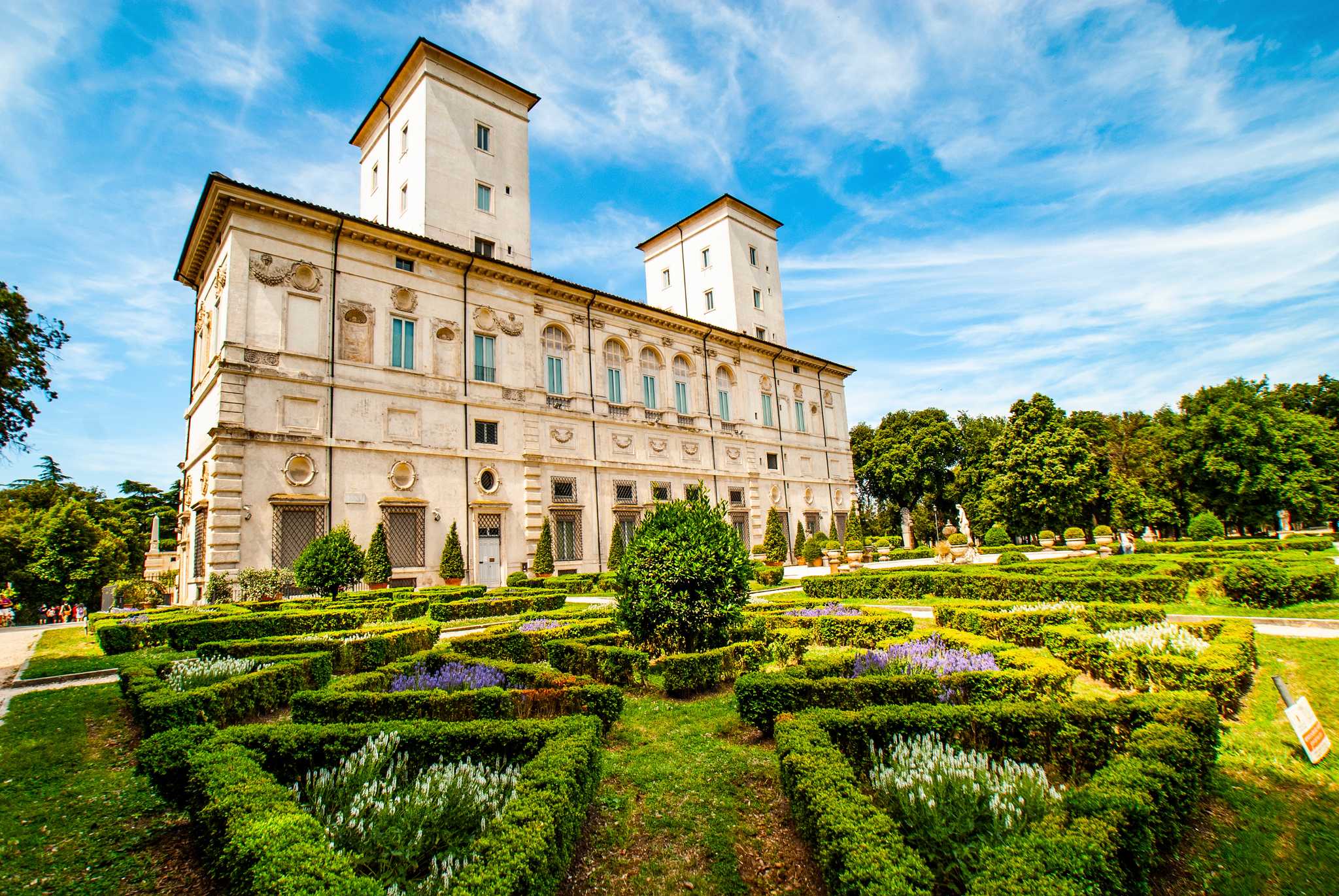 The Galleria Borghese villa above the clipped box hedges of its formal garden.