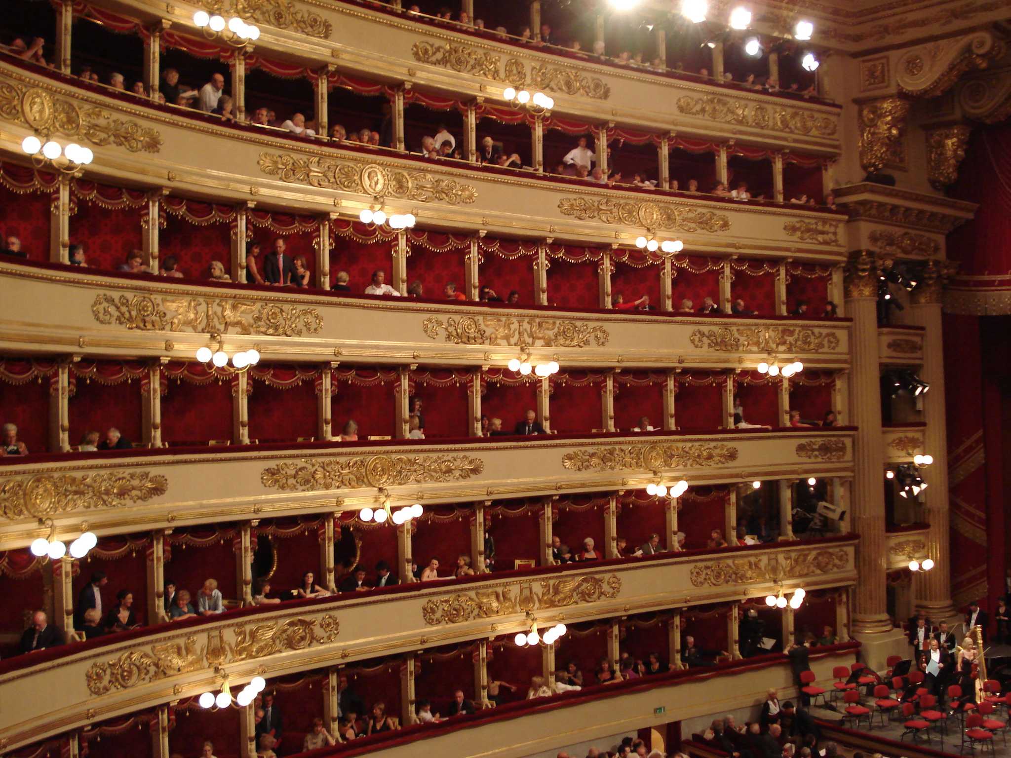 Curved balconies rising around the auditorium inside La Scala opera house in Milan.