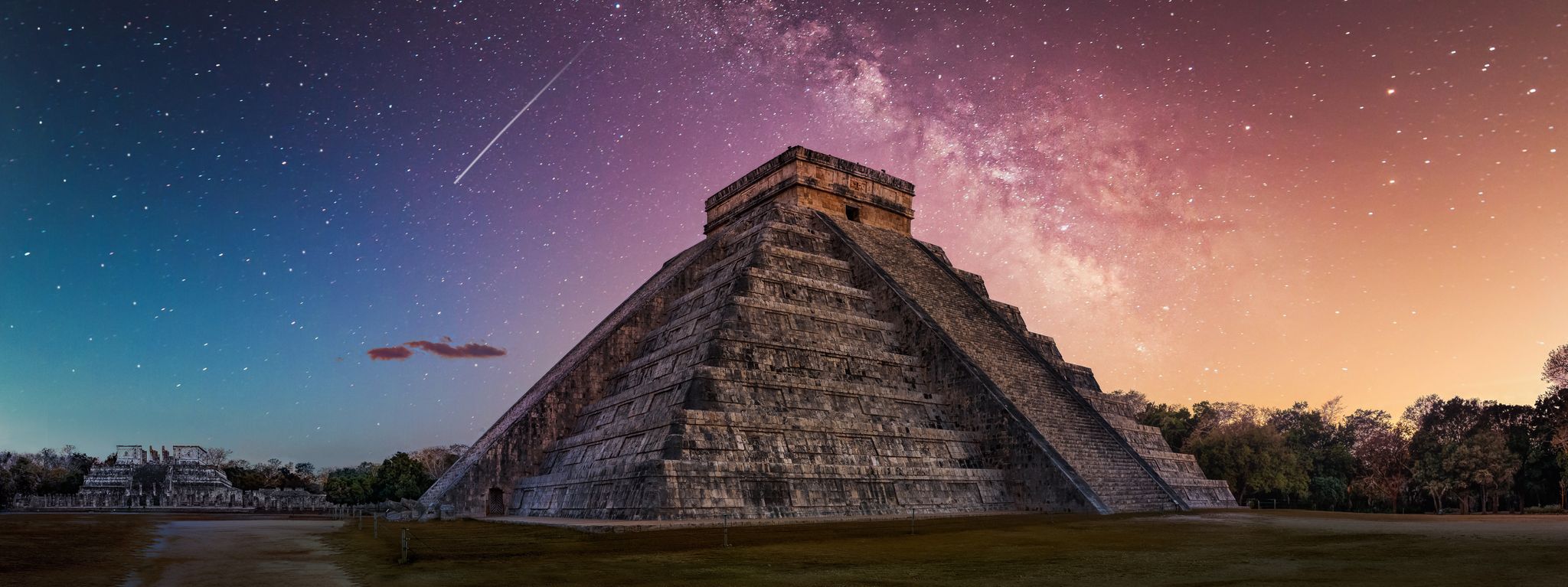 El Castillo pyramid at Chichén Itzå under a starry sky with the Milky Way overhead.