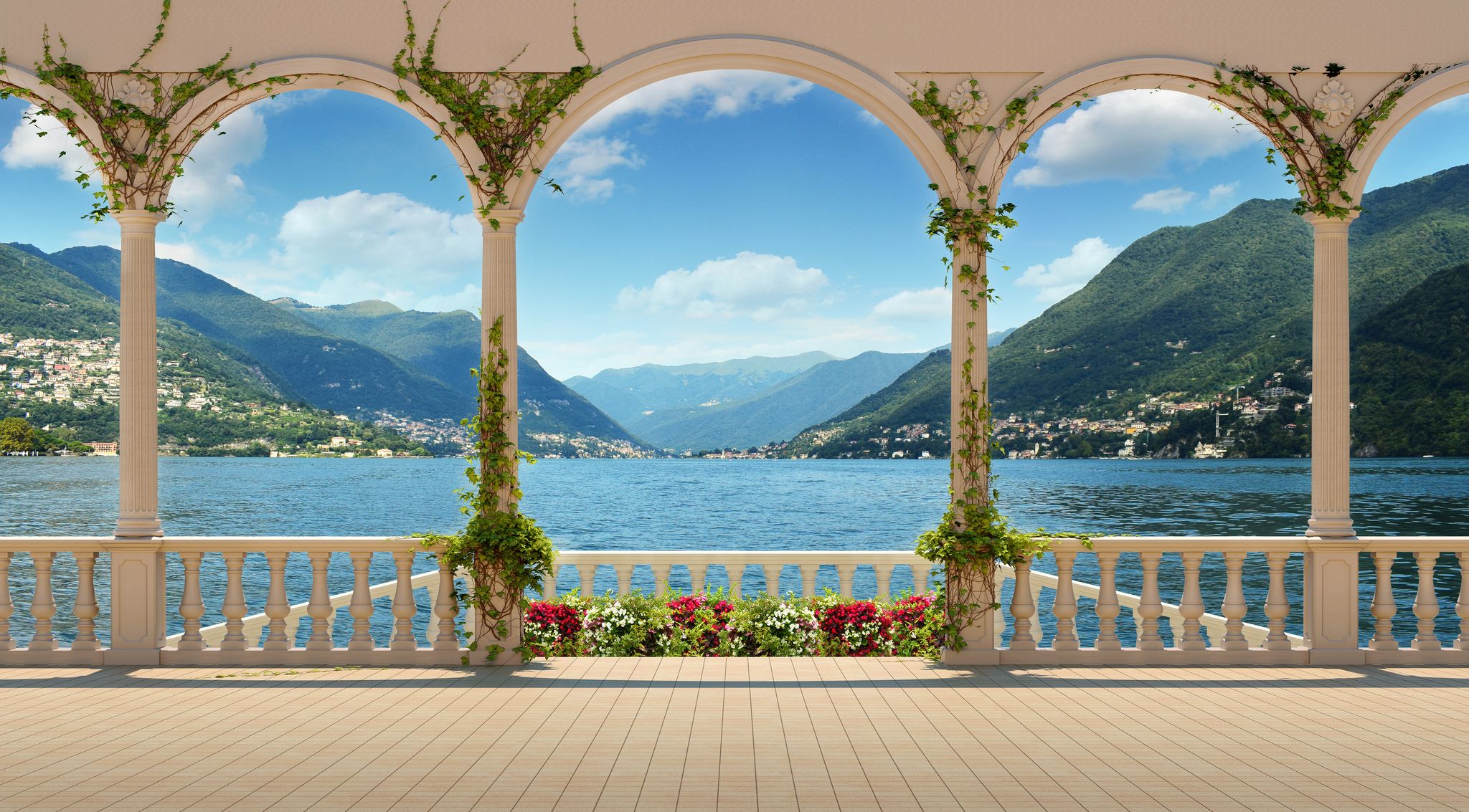 Lake Como seen through the arches of a vine-covered terrace.