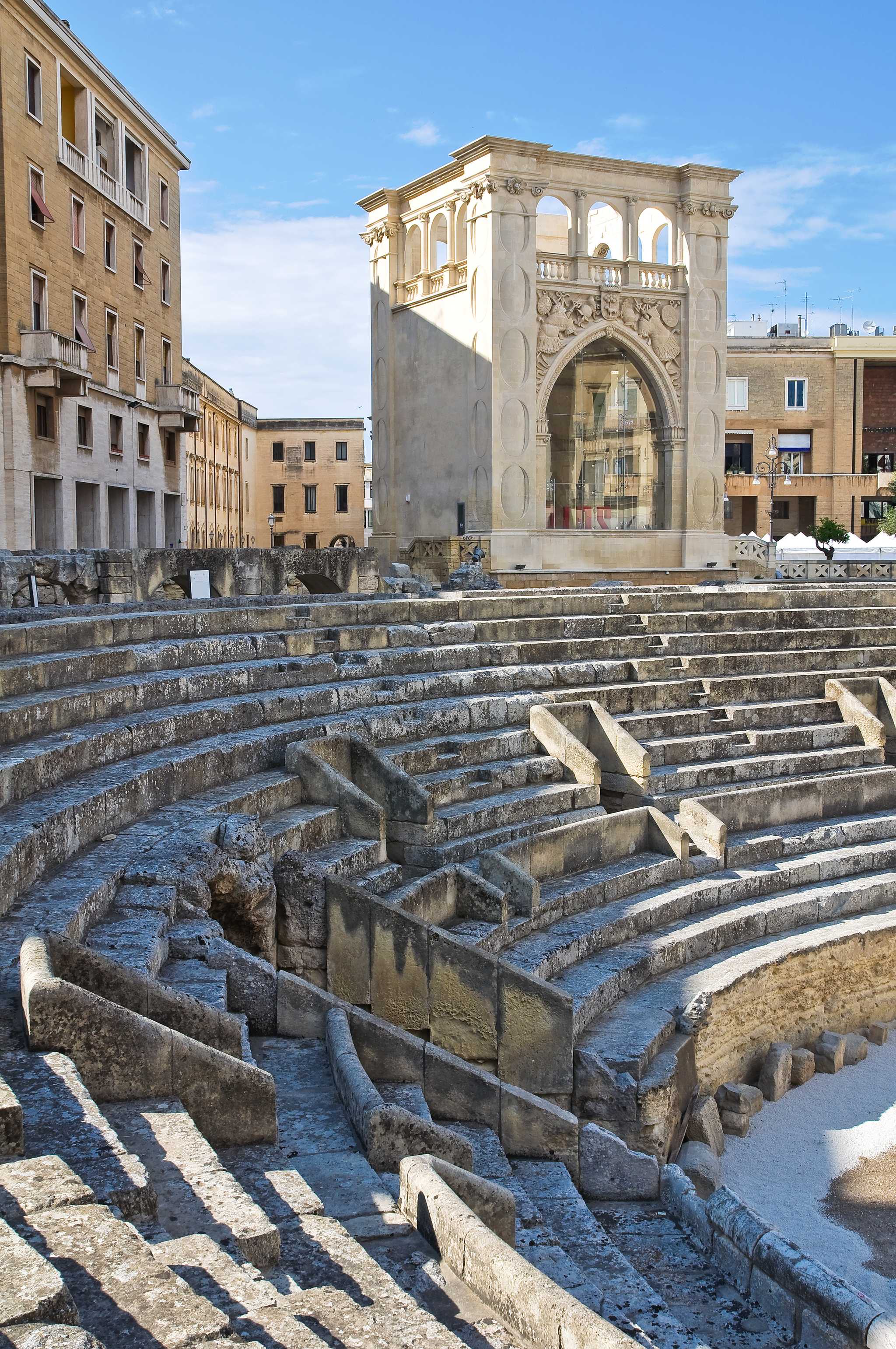 Roman amphitheater of Lecce, focused on its stone seating.