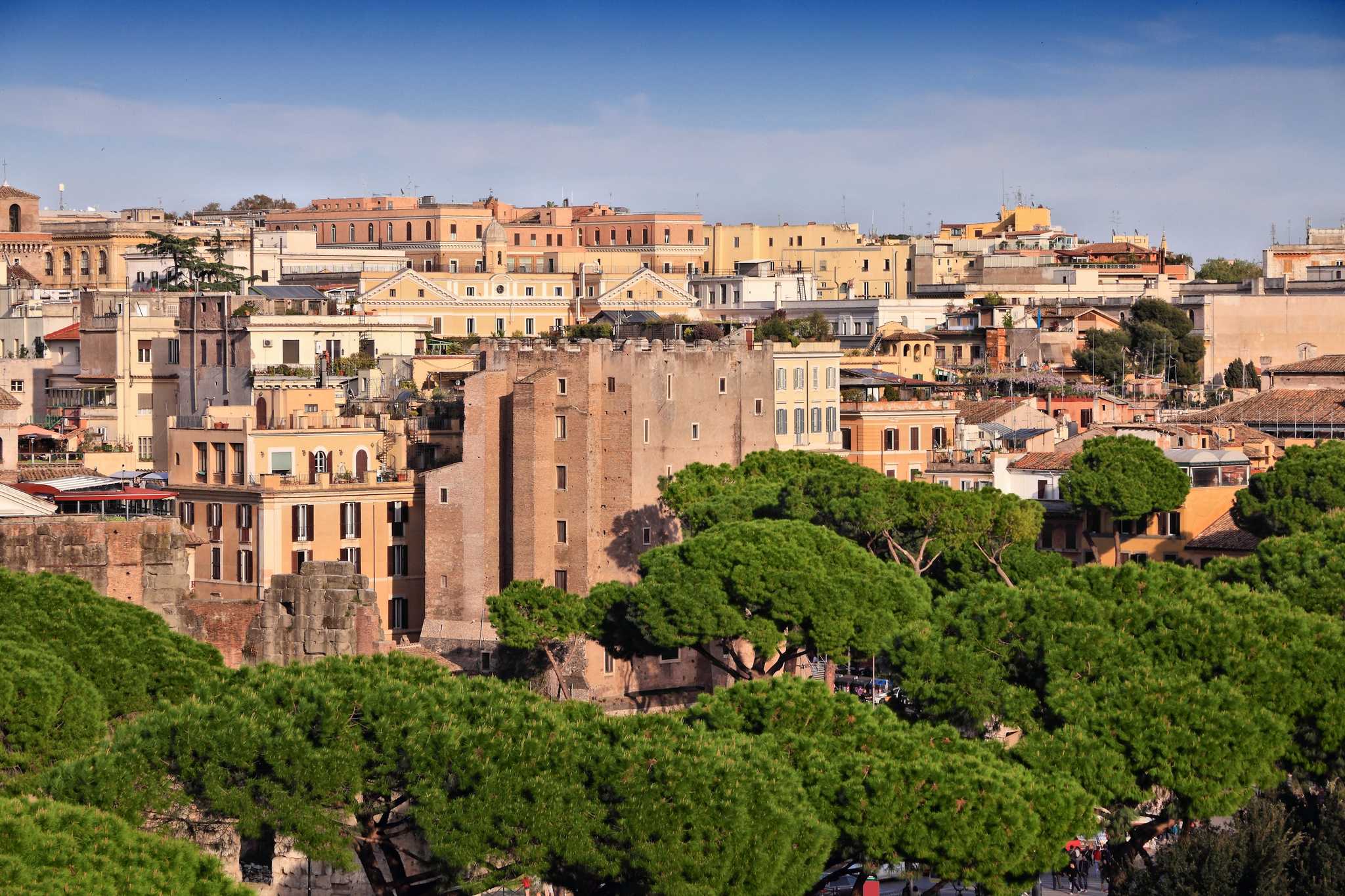 The medieval Torre dei Conti among the rooftops and umbrella pines of Rome's Monti.