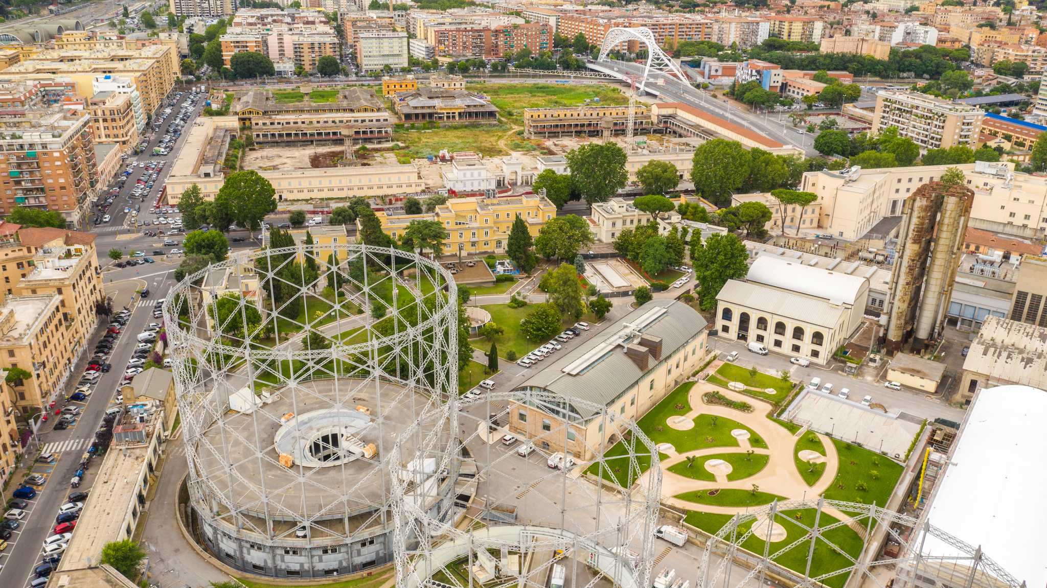 Aerial view of the Gazometro's iron gasholders over Ostiense, Rome's old industrial district.