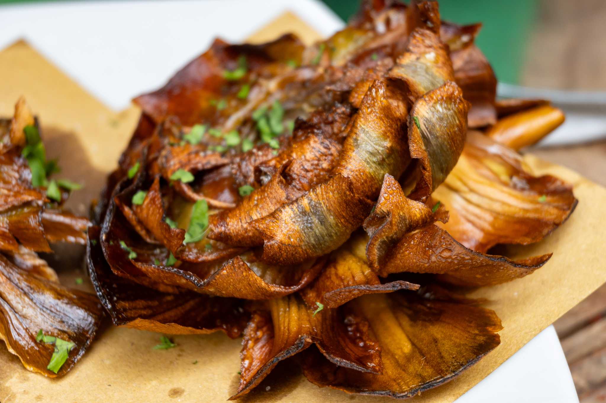 Carciofi alla giudia, whole artichokes fried until the leaves are crisp and bronzed.