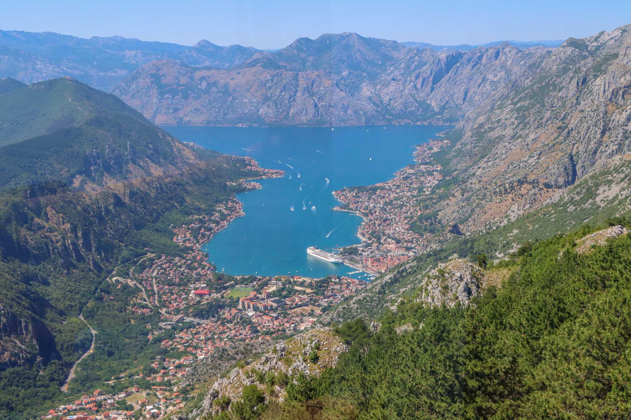The Bay of Kotor as seen from the cable car, with the town and bay surrounded by hills.