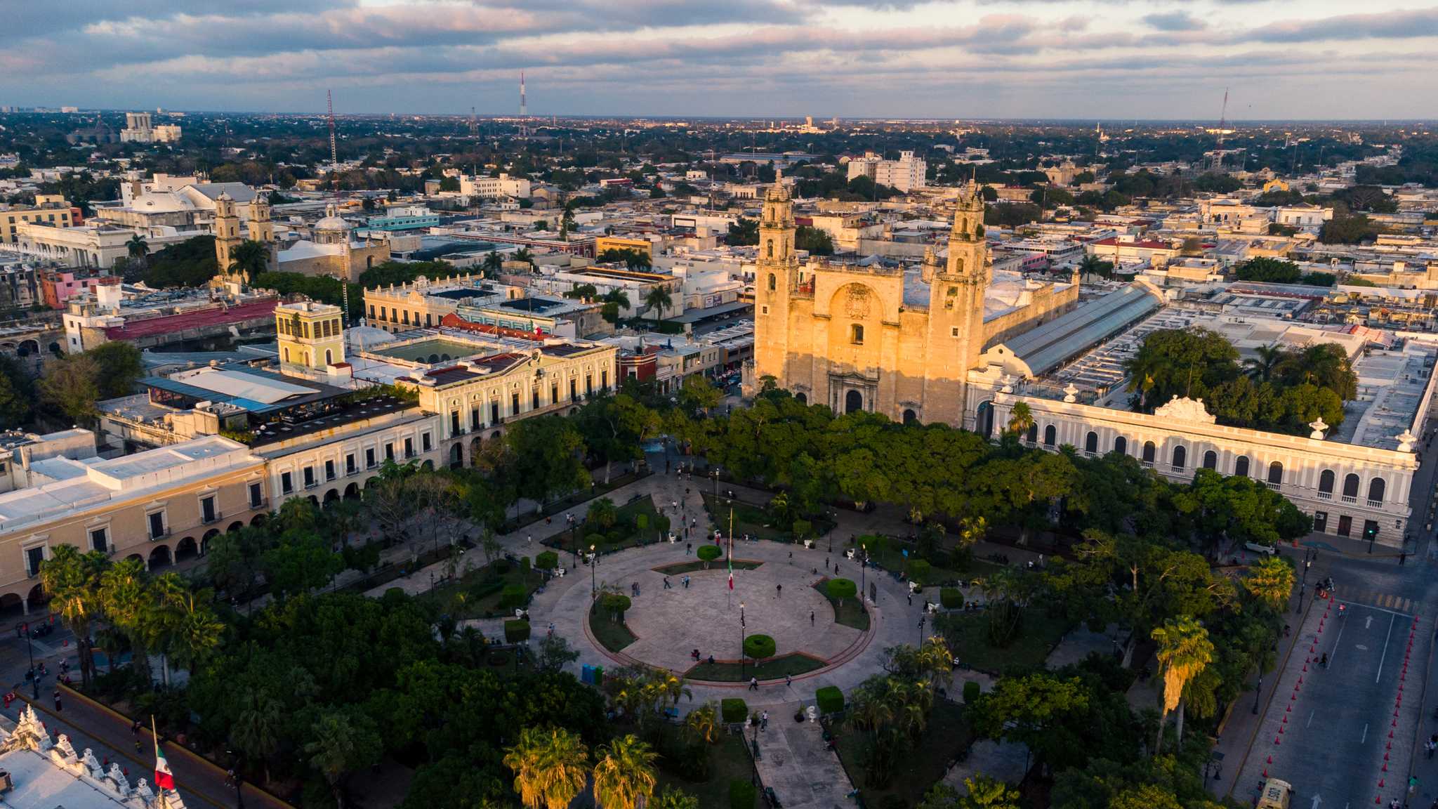 Aerial view of Mérida Cathedral and the Plaza Grande in low golden light.