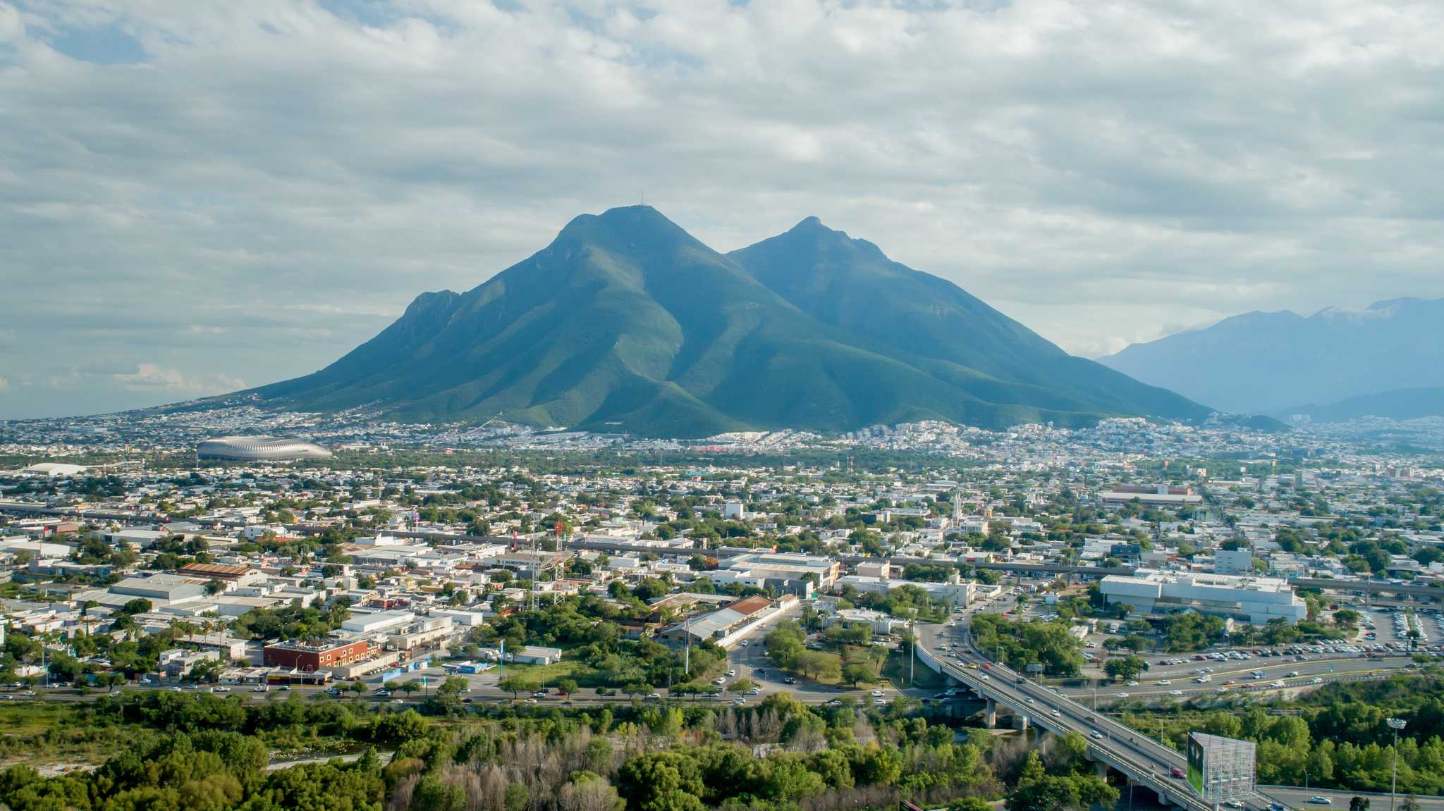 The saddle hill in Monterrey, Mexico, on a cloudy day with the city below.