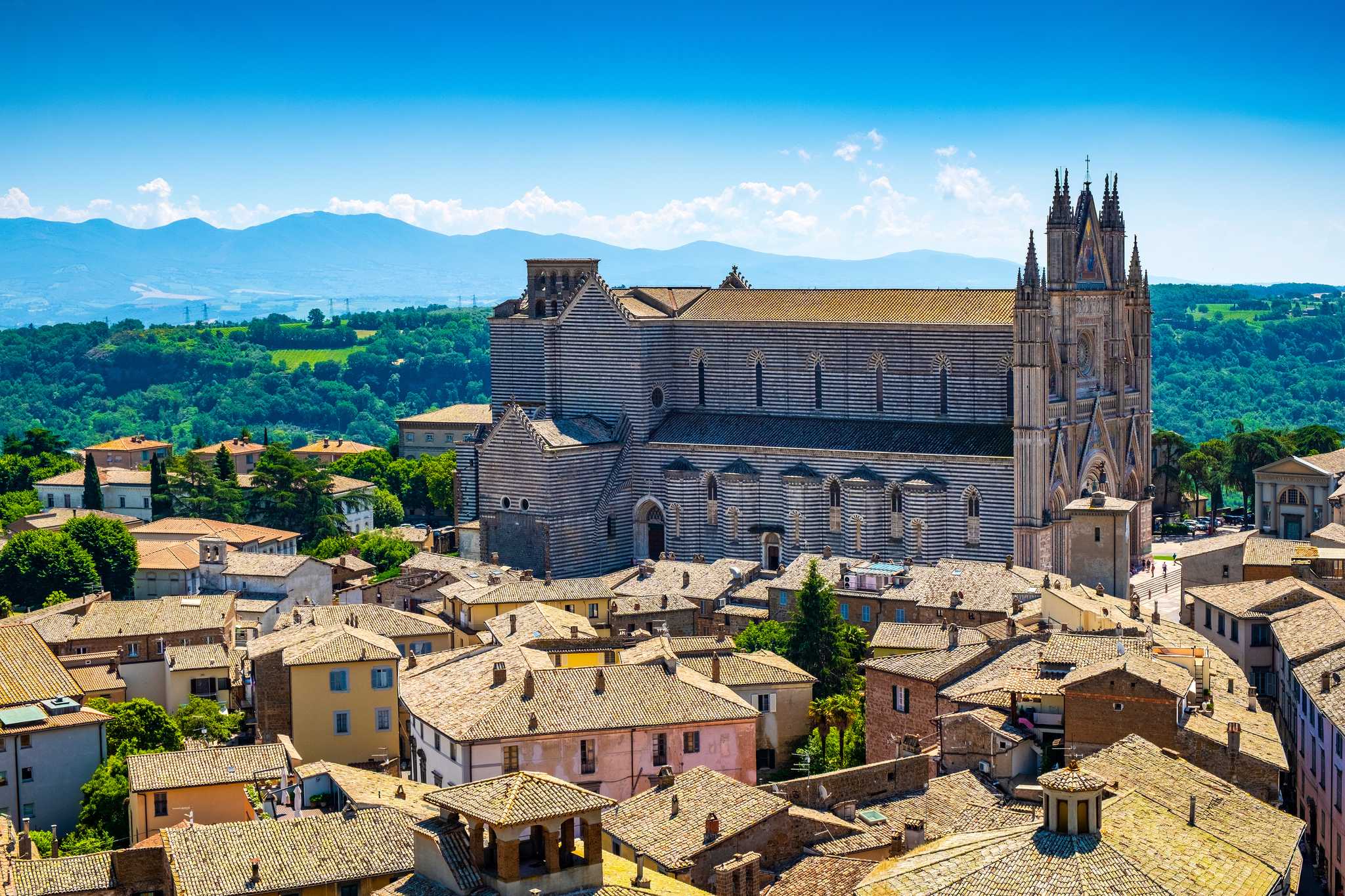 The hilltop town of Orvieto from a distance focused on the Cathedral.