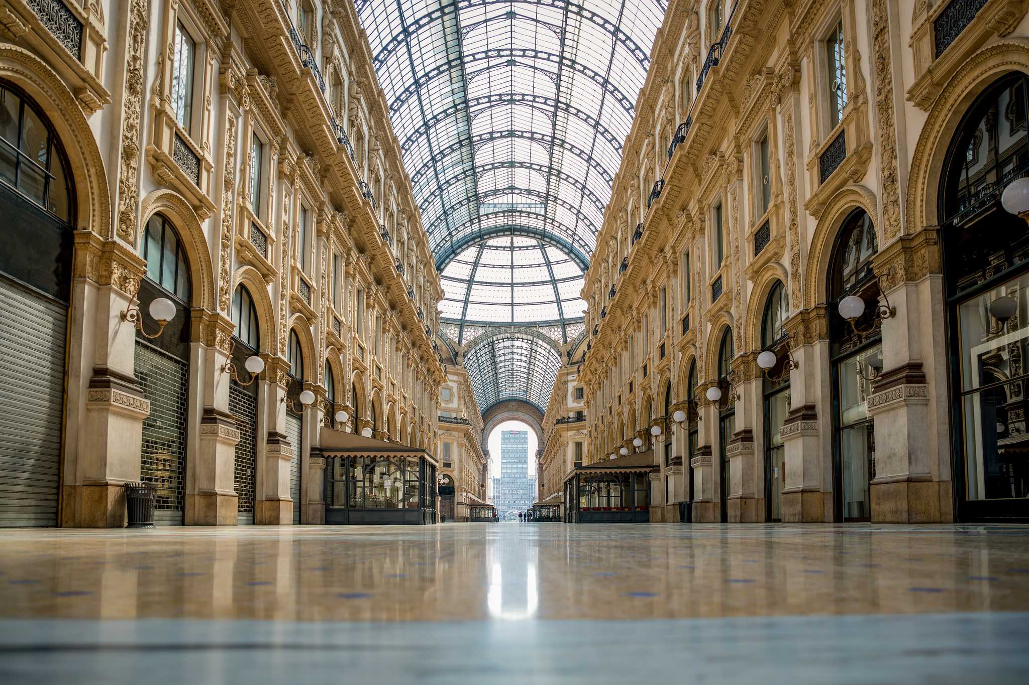 A bold shot of Galleria Vittorio Emanuele II’s glass roof and hall of shops.