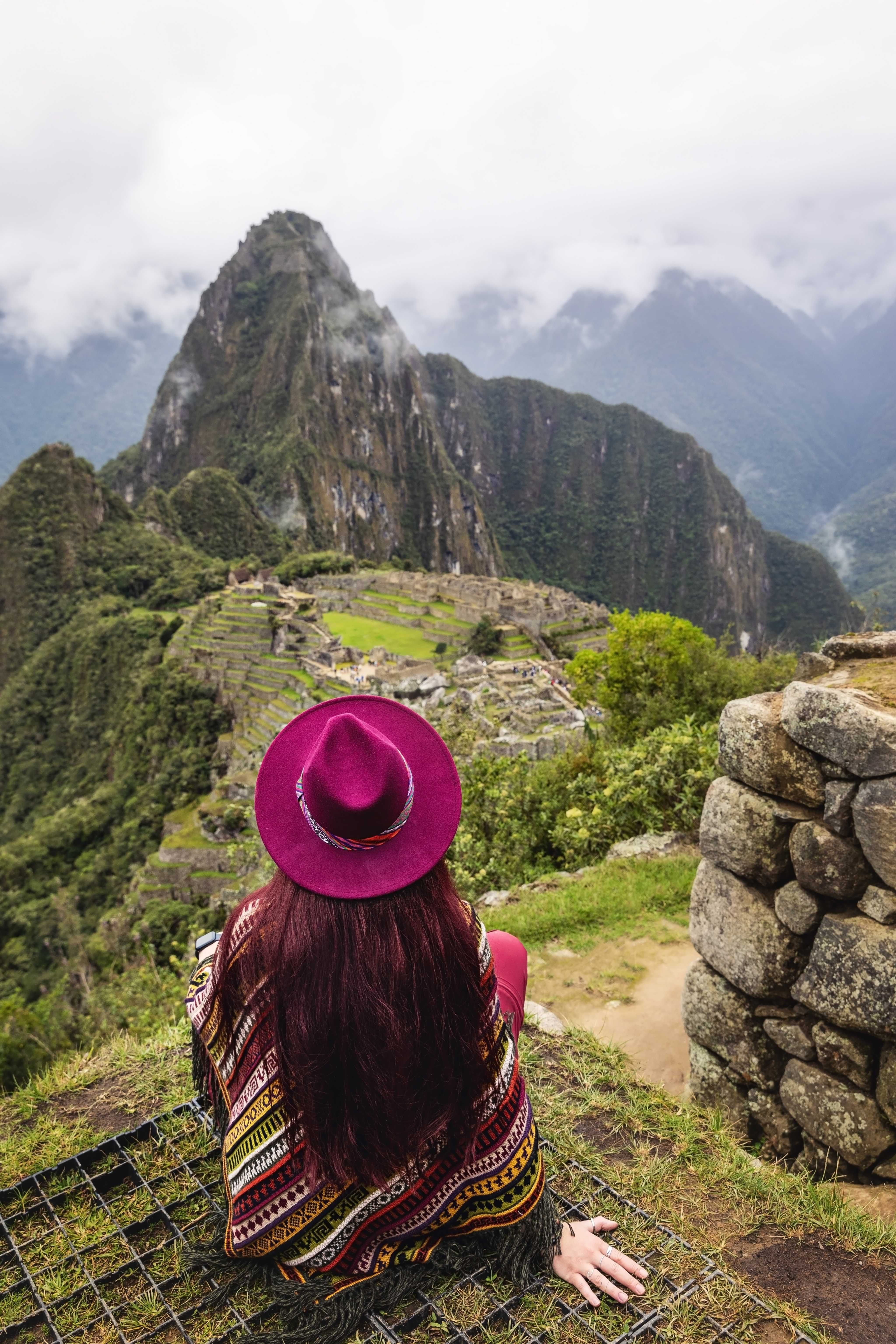 A woman looks at the beautiful mountain side